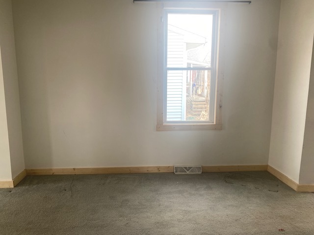215 West 5th Street Spring Valley, IL 61362 - Photo 6 of 7 an empty room with a window