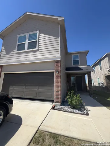 a house view with a backyard space