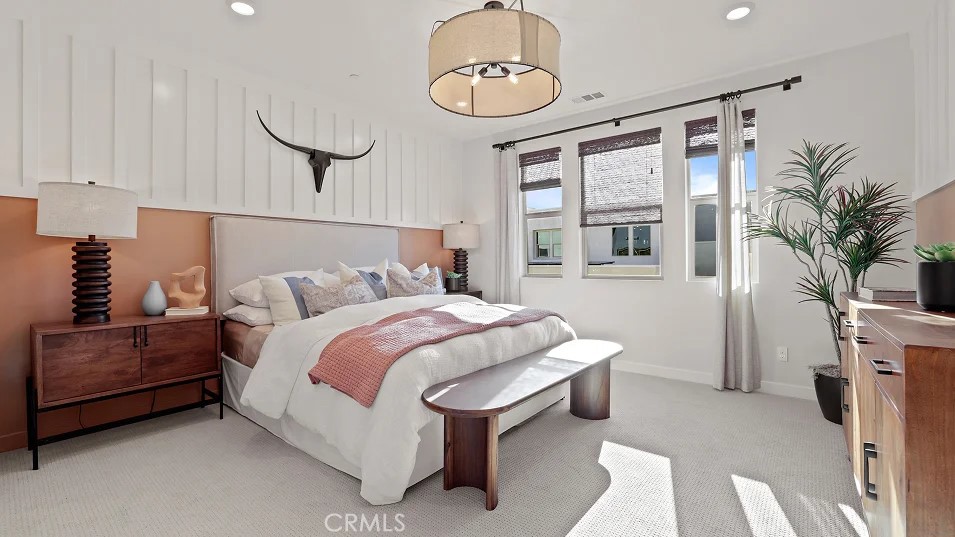 965 Walnut Terrace Montebello, CA 90640 - Photo 14 of 36 a spacious bedroom with a bed and a chandelier