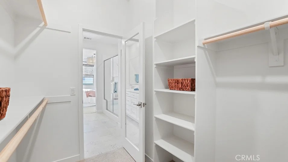 965 Walnut Terrace Montebello, CA 90640 - Photo 19 of 36 a walk in closet with view of bathroom