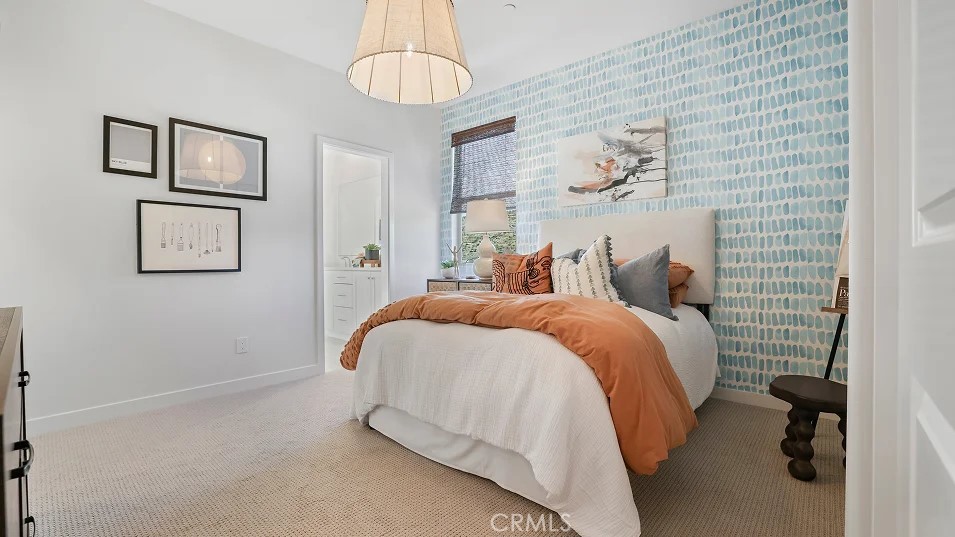 965 Walnut Terrace Montebello, CA 90640 - Photo 25 of 36 a bedroom with a bed and a chandelier