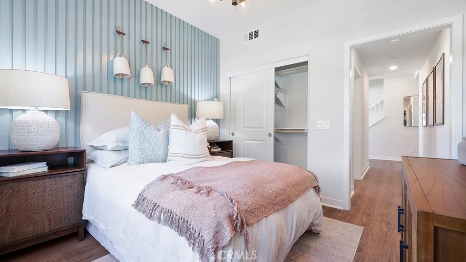 965 Walnut Terrace Montebello, CA 90640 - Photo 27 of 36 a bedroom with a bed and a lamp