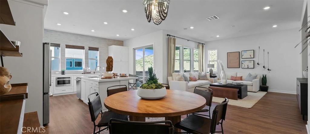 965 Walnut Terrace Montebello, CA 90640 - Photo 10 of 36 a view of a dining room with furniture window and wooden floor