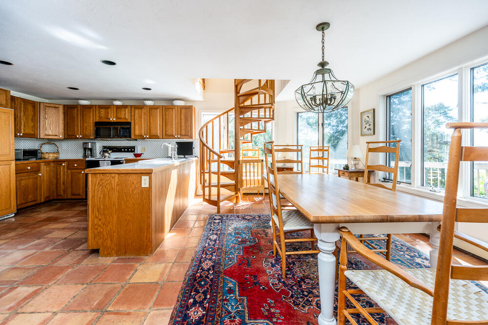 498 Elliott Road Centerville, MA 02632 - Photo 14 of 32 a kitchen with stainless steel appliances granite countertop a stove and refrigerator