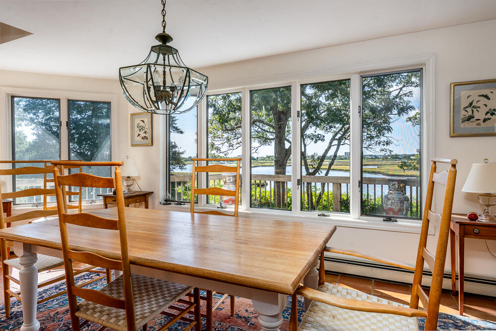 498 Elliott Road Centerville, MA 02632 - Photo 16 of 32 a view of a dining room with furniture window and outside view