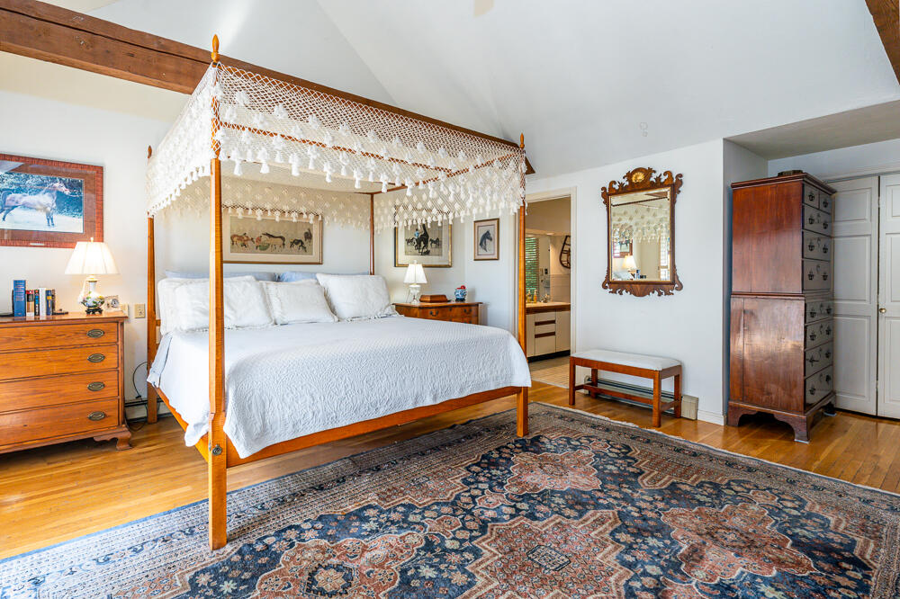 498 Elliott Road Centerville, MA 02632 - Photo 20 of 32 a bedroom with a bed and wooden floor