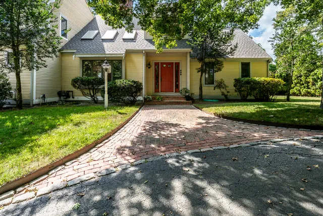 a front view of a house with garden