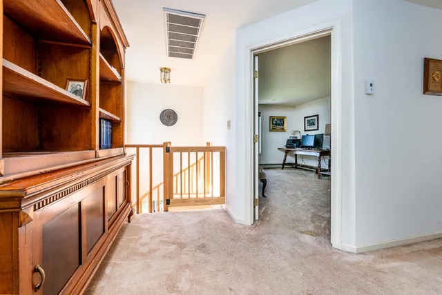 a view of an entryway with wooden floor