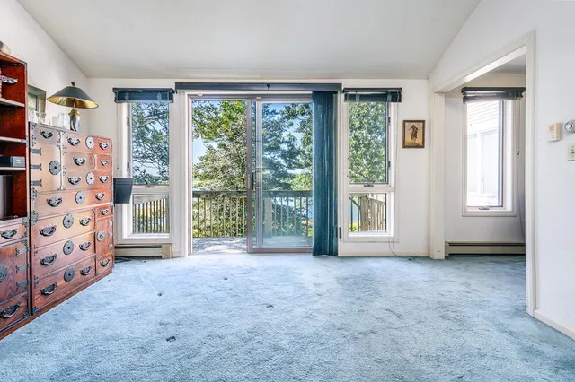 a view of livingroom with furniture and floor to ceiling window