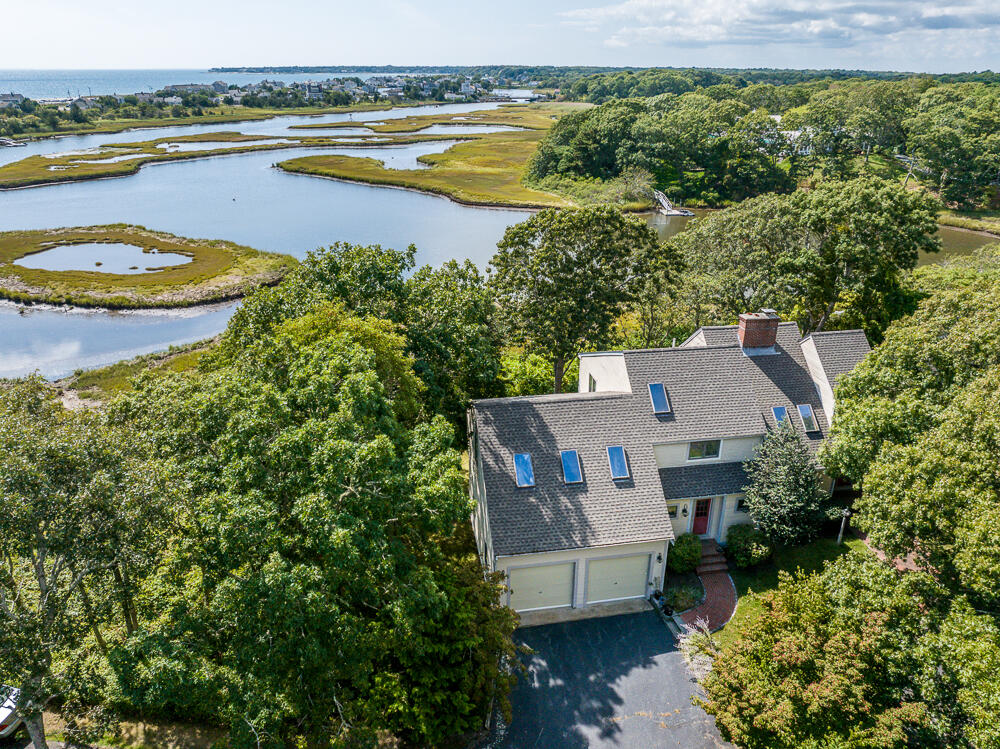 498 Elliott Road Centerville, MA 02632 - Photo 8 of 32 an aerial view of a house with outdoor space swimming pool and lake view