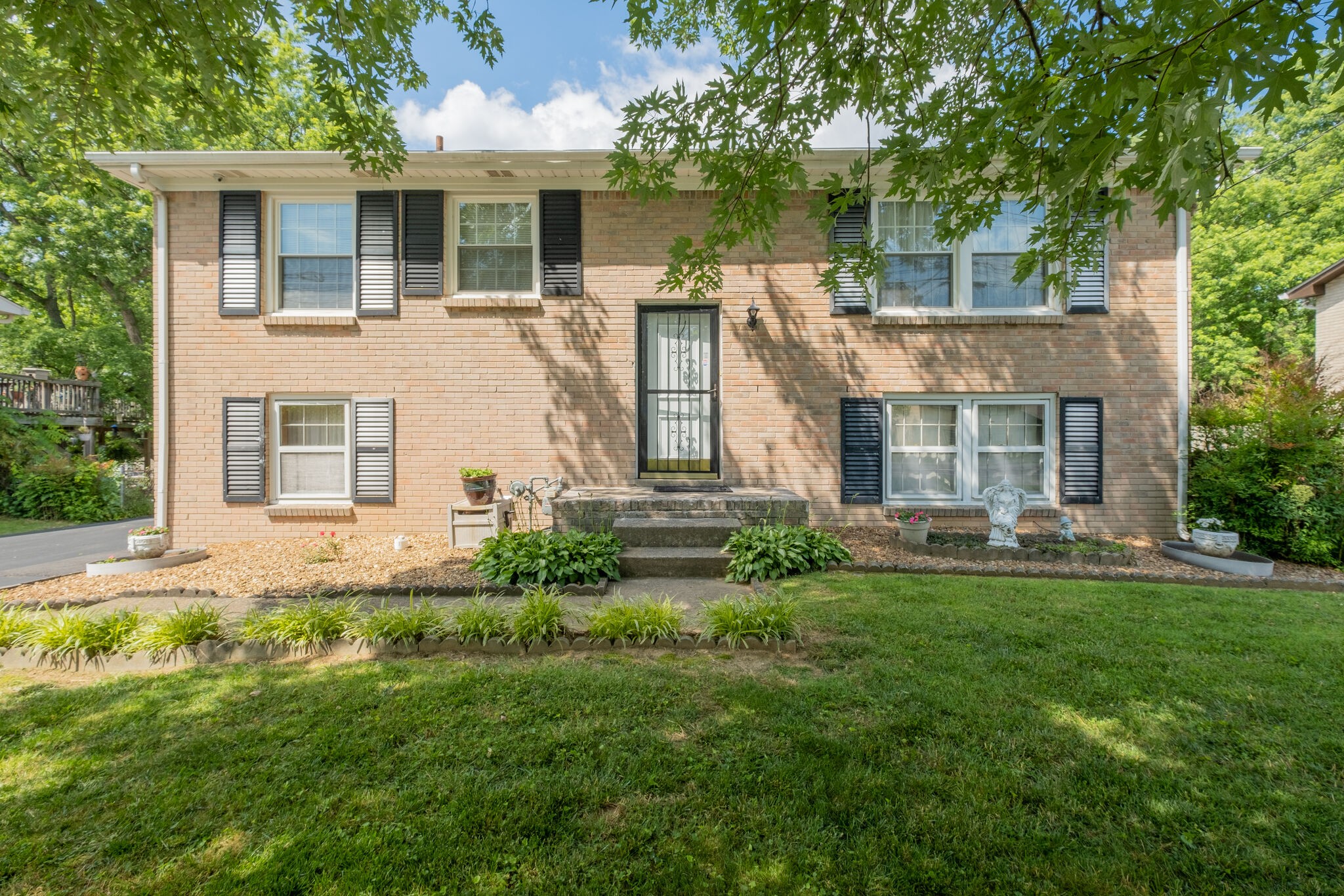 front view of a house with a yard