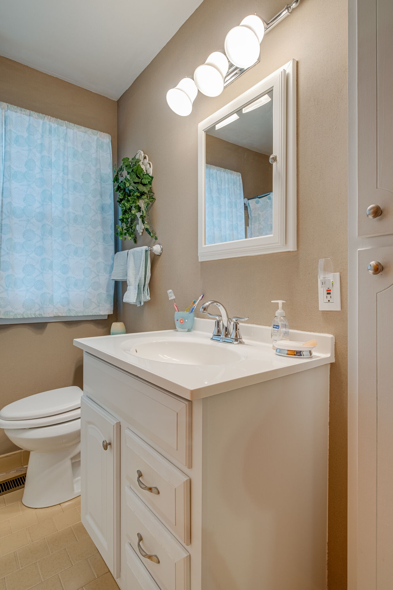 236 Bart Drive Antioch, TN 37013 - Photo 16 of 23 a bathroom with a toilet sink and mirror