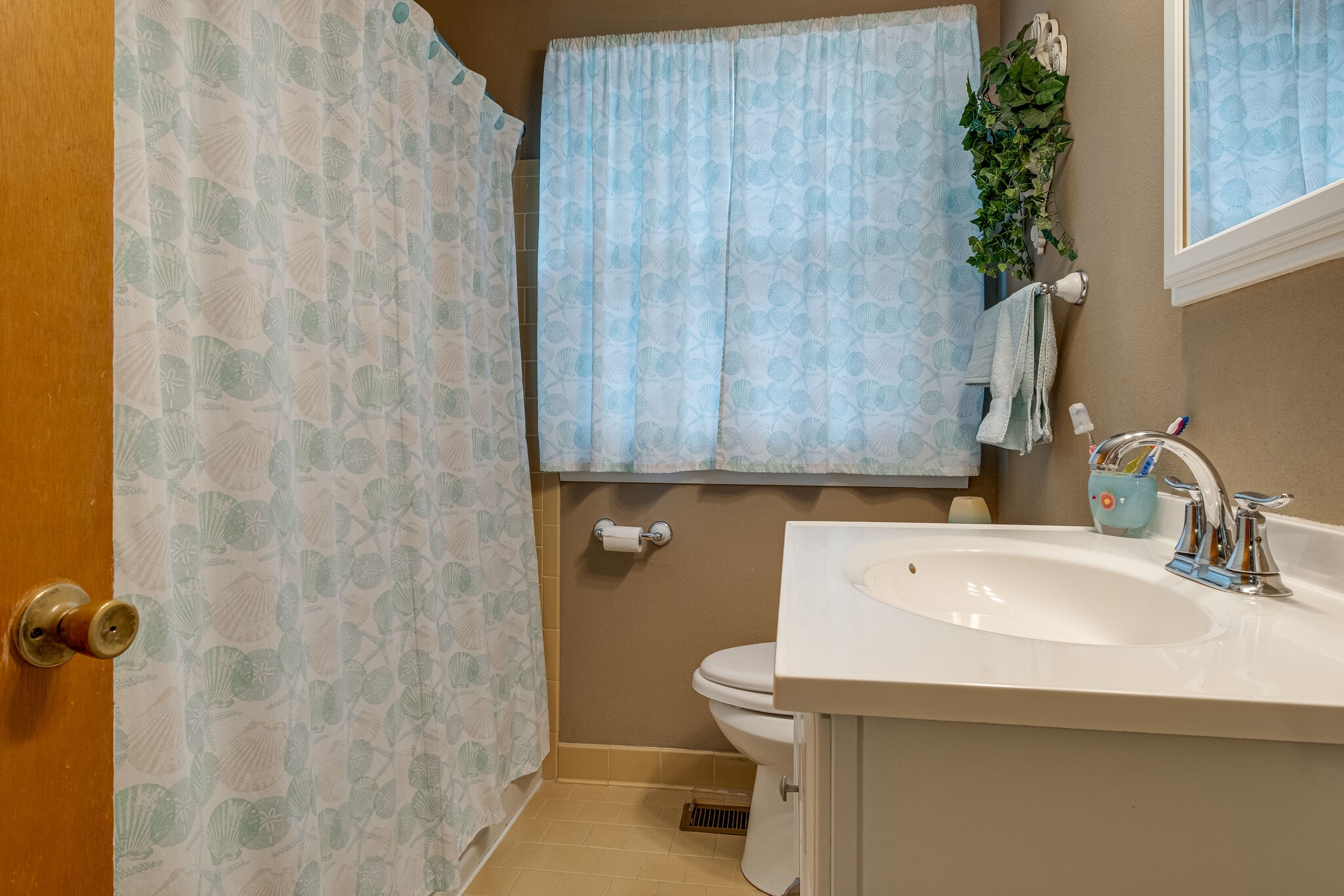 236 Bart Drive Antioch, TN 37013 - Photo 17 of 23 a bathroom with a sink a toilet and shower