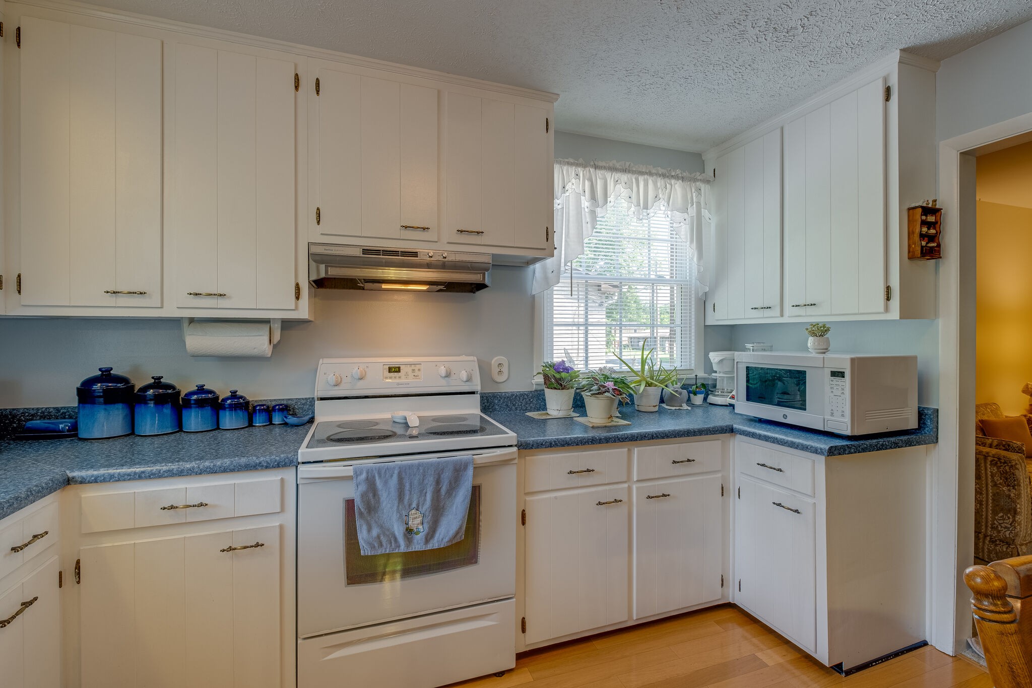 236 Bart Drive Antioch, TN 37013 - Photo 9 of 23 a kitchen with white cabinets and white appliances