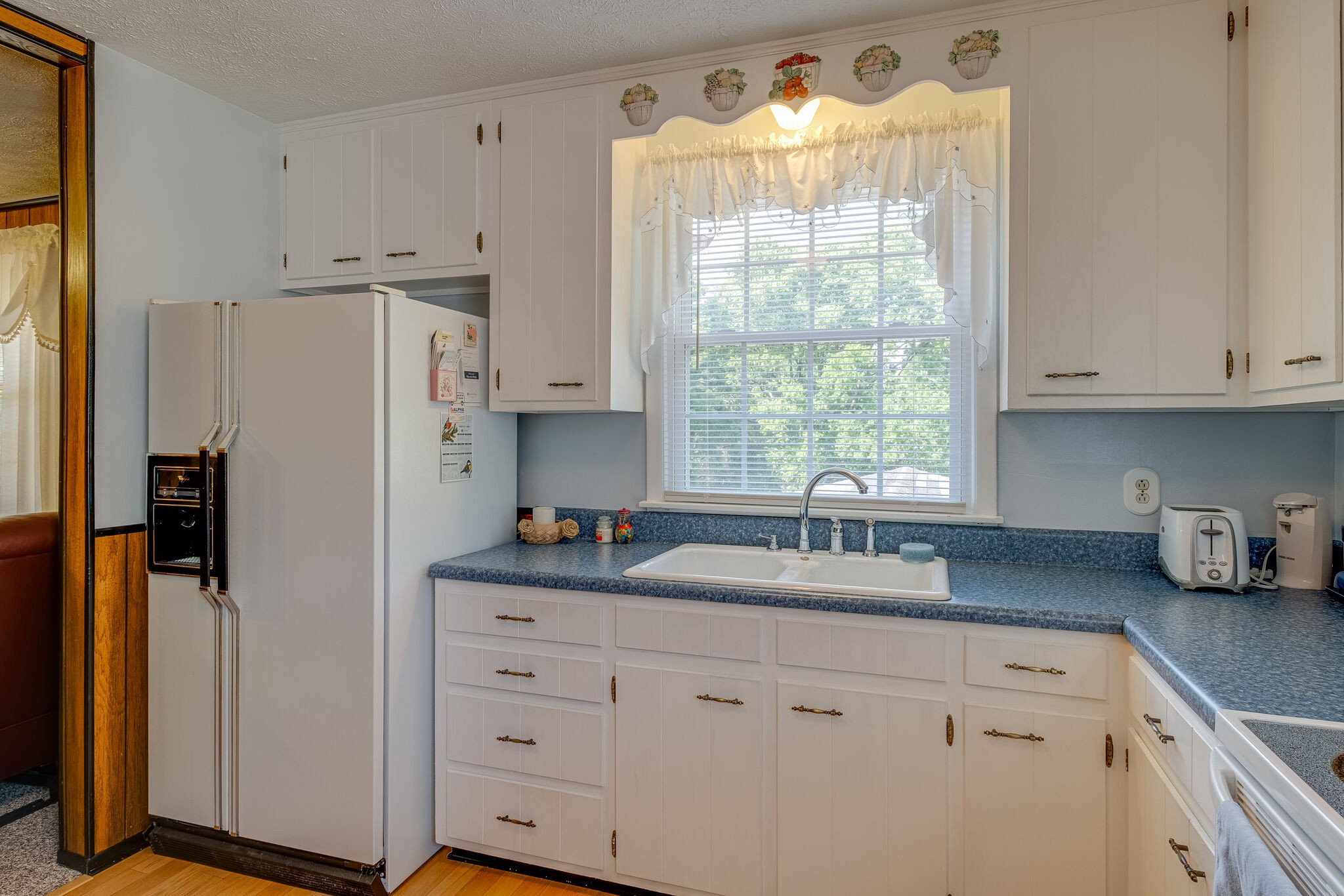 236 Bart Drive Antioch, TN 37013 - Photo 10 of 23 a kitchen with stainless steel appliances white cabinets and a window