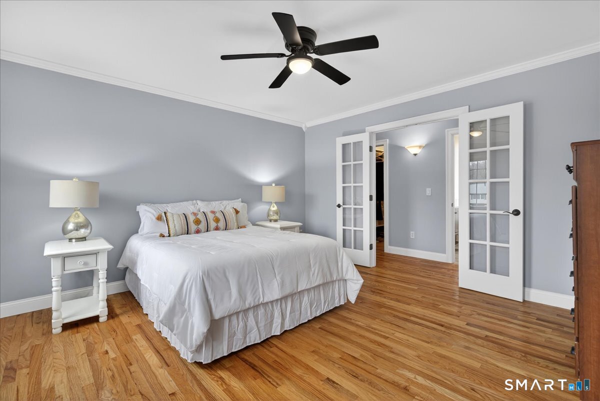 22 Emerald Lane Bethany, CT 06524 - Photo 16 of 28 a bedroom with a bed and wooden floor