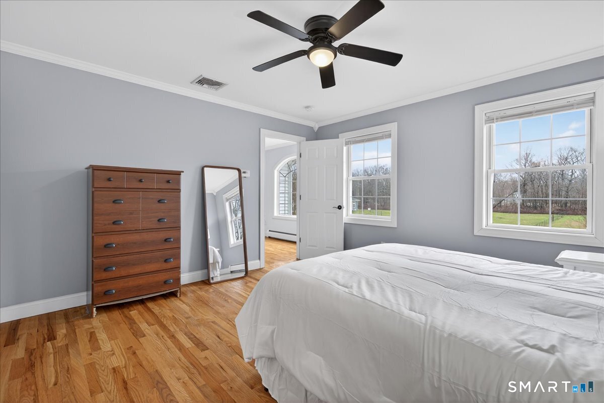 22 Emerald Lane Bethany, CT 06524 - Photo 17 of 28 a bedroom with a bed and a dresser