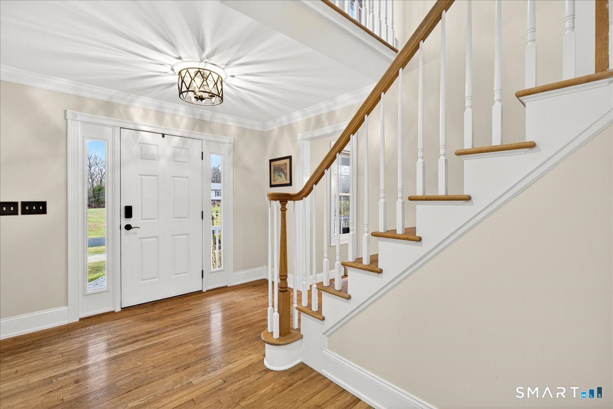 22 Emerald Lane Bethany, CT 06524 - Photo 2 of 28 a view of entryway and hall with wooden floor