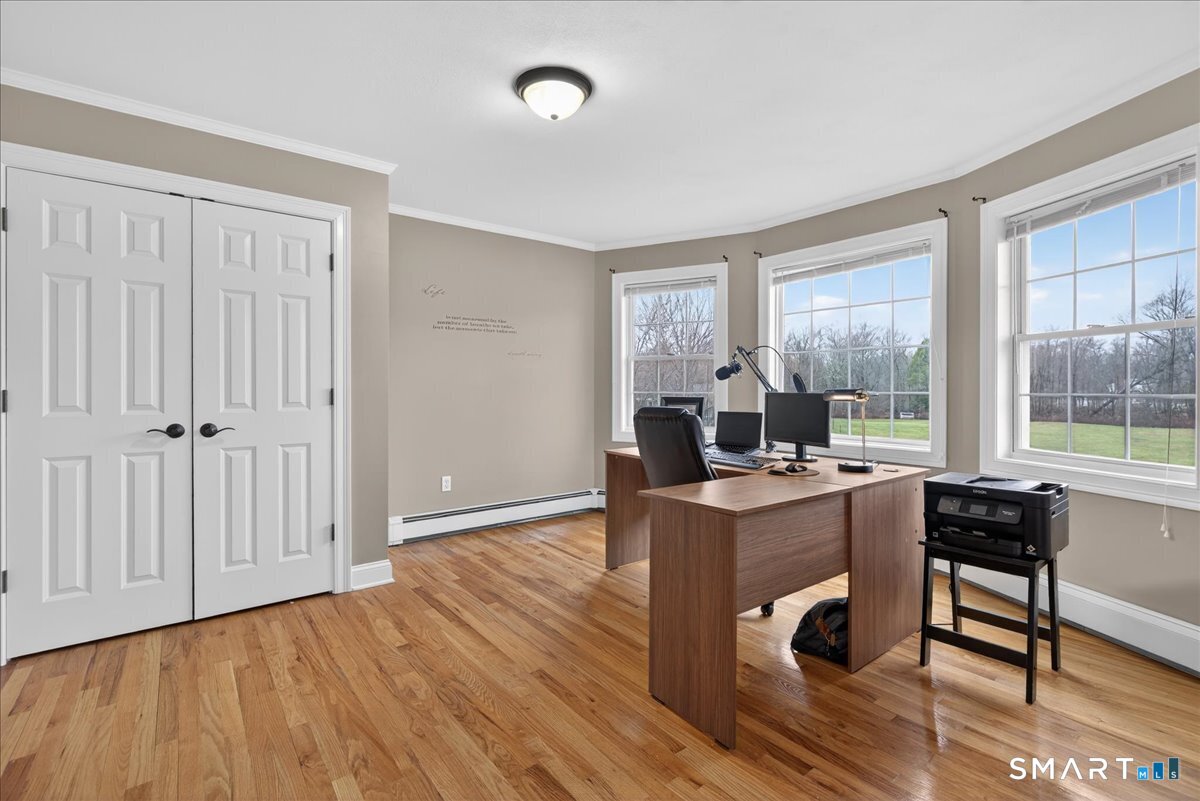 22 Emerald Lane Bethany, CT 06524 - Photo 21 of 28 a view of a workspace with furniture and a window