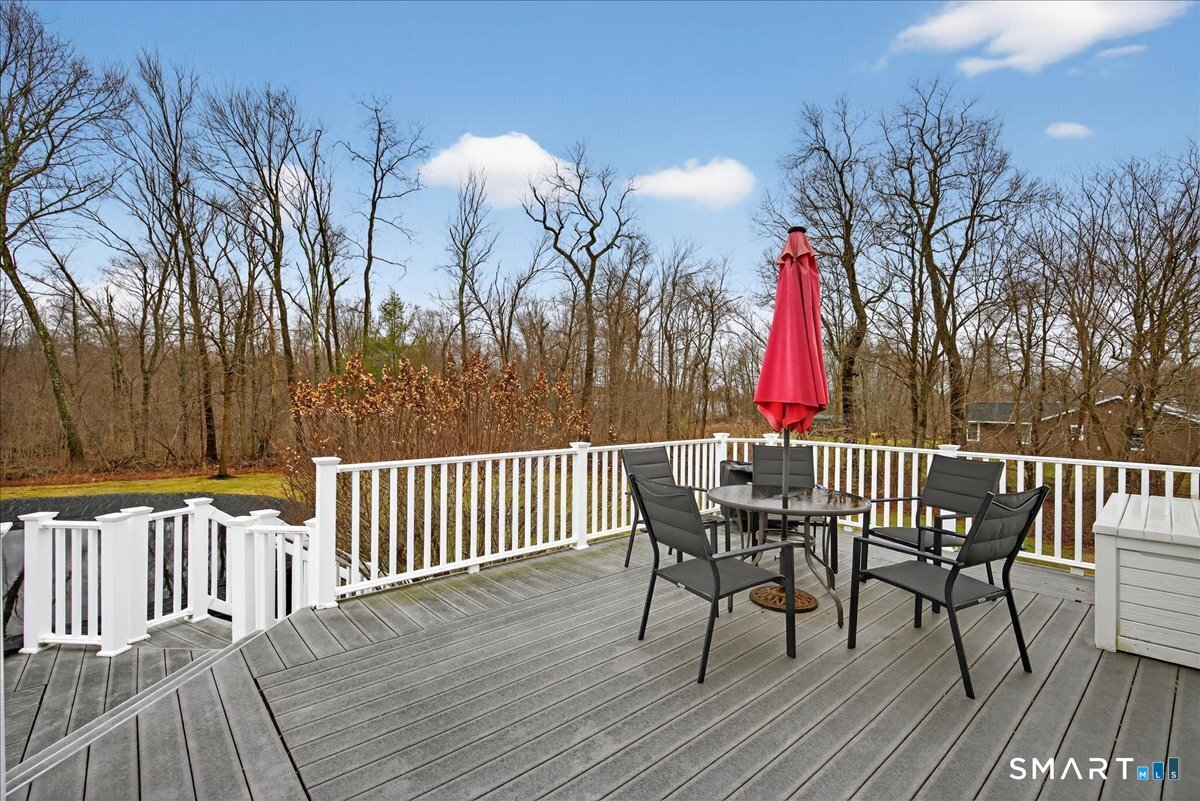 22 Emerald Lane Bethany, CT 06524 - Photo 24 of 28 a view of a wooden deck with furniture