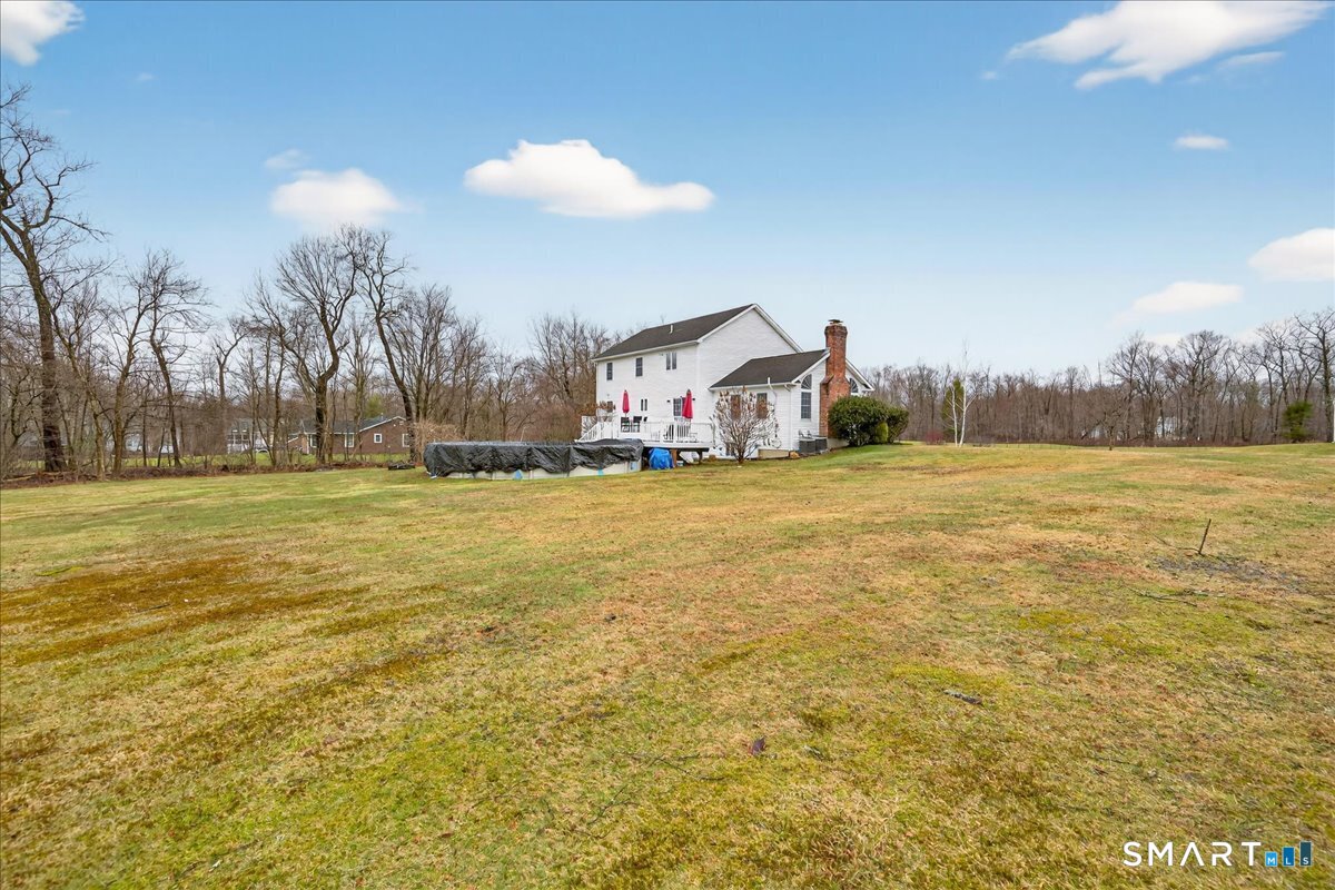 22 Emerald Lane Bethany, CT 06524 - Photo 26 of 28 a view of a field with an house