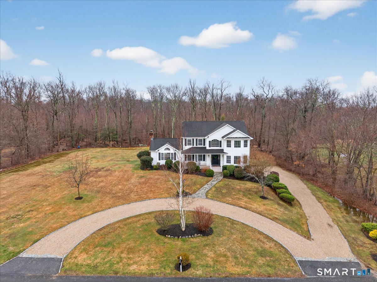 22 Emerald Lane Bethany, CT 06524 - Photo 28 of 28 a view of a fountain in front of the house
