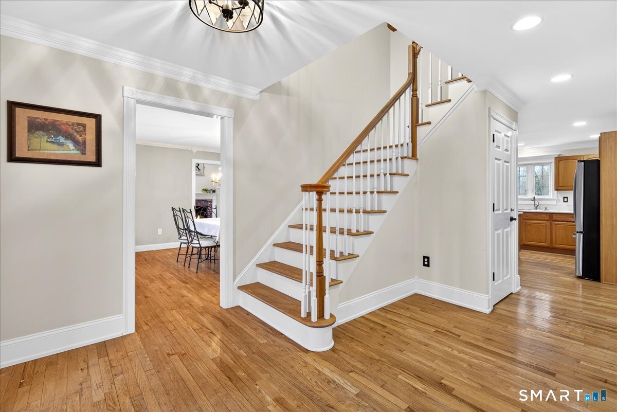 22 Emerald Lane Bethany, CT 06524 - Photo 3 of 28 a view of entryway with wooden floor