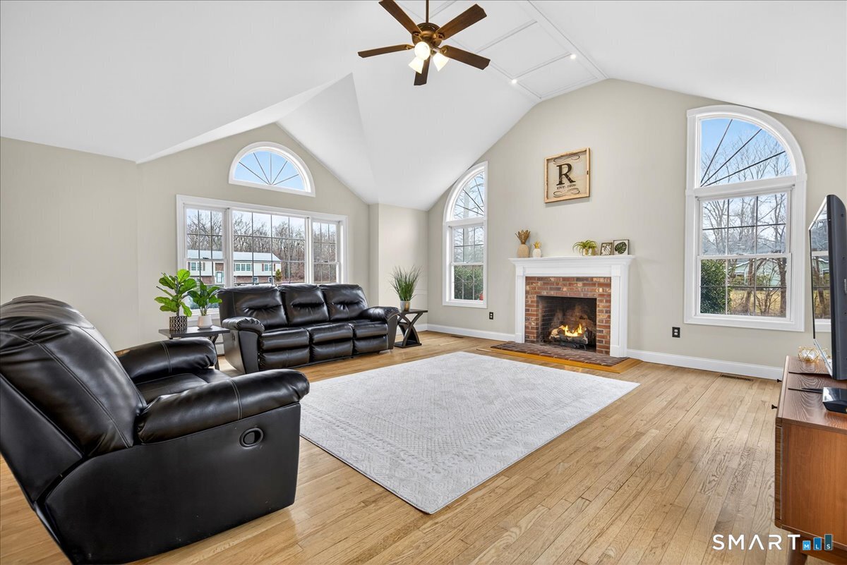 22 Emerald Lane Bethany, CT 06524 - Photo 5 of 28 a living room with furniture fireplace and window