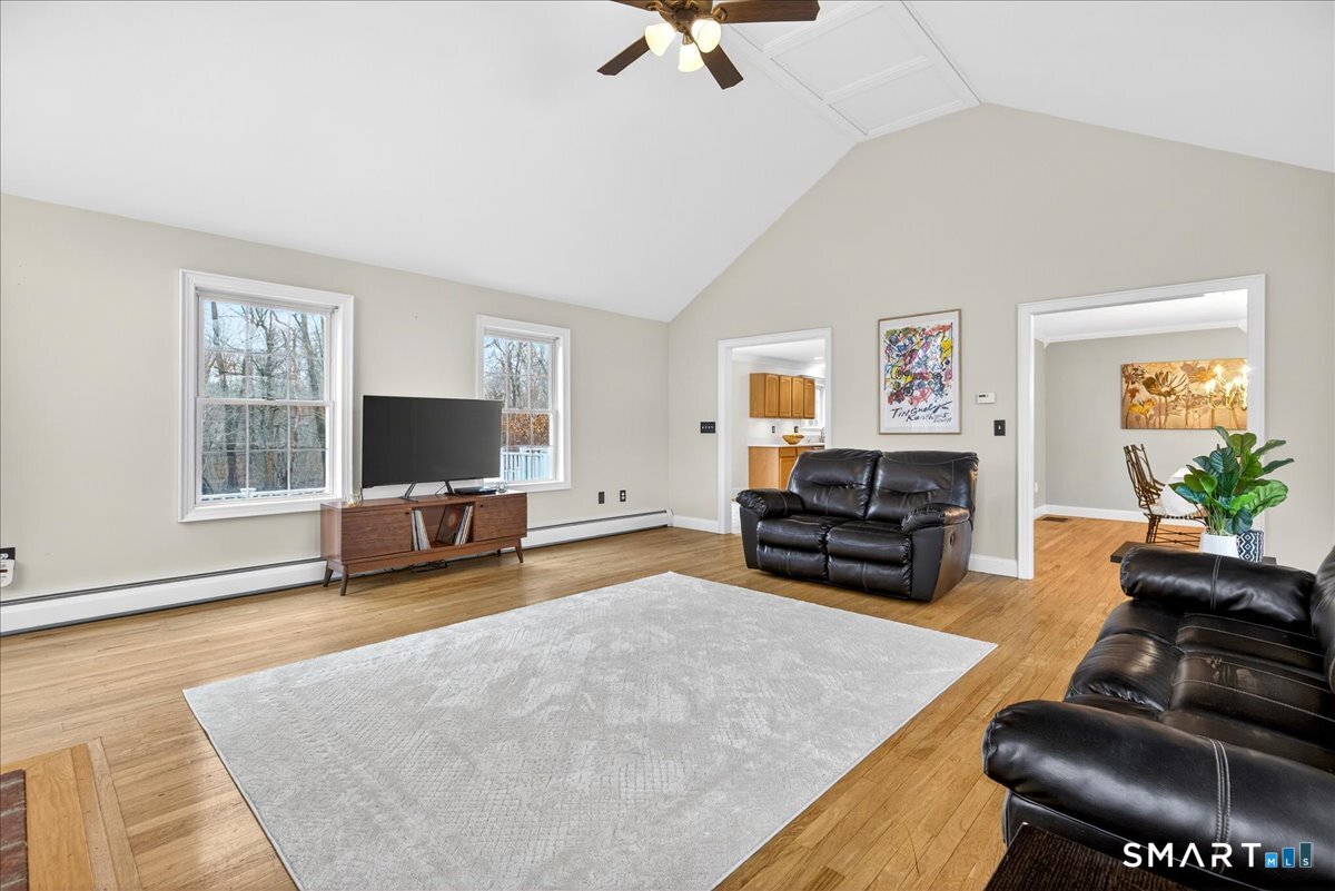 22 Emerald Lane Bethany, CT 06524 - Photo 6 of 28 a living room with furniture and a flat screen tv