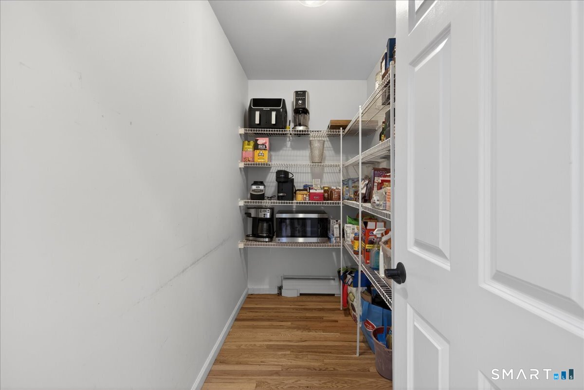 22 Emerald Lane Bethany, CT 06524 - Photo 10 of 28 a hallway with a shelf