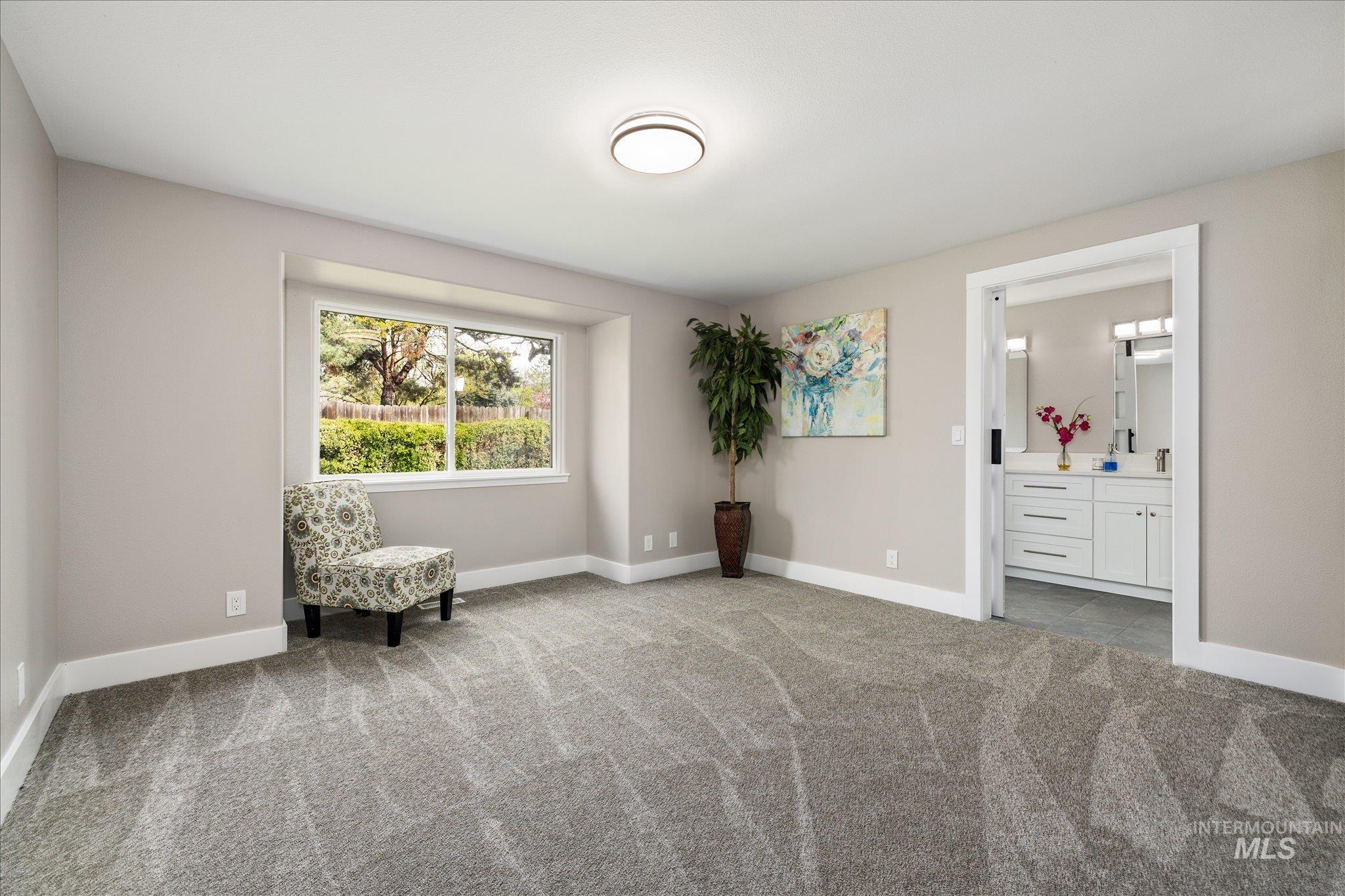 2250 North Amethyst Avenue Meridian, ID 83646 - Photo 29 of 50 Living area featuring baseboards and light colored carpet