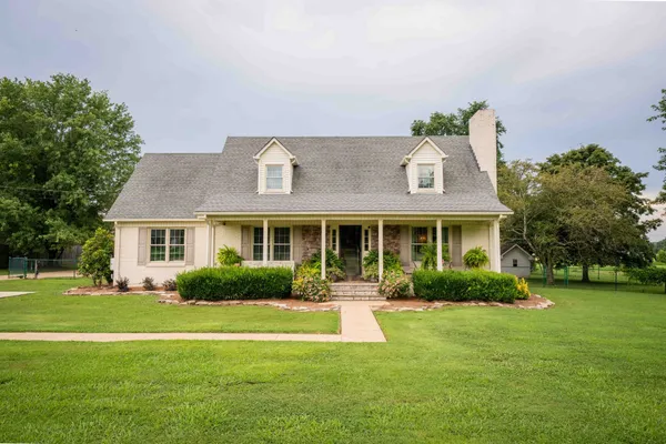 a front view of house with yard and green space