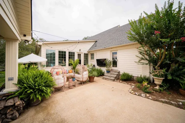 a view of swimming pool with outdoor seating