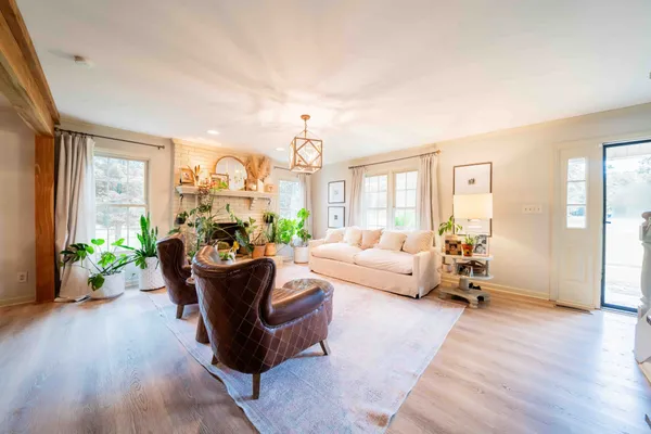 a living room with furniture and a large window