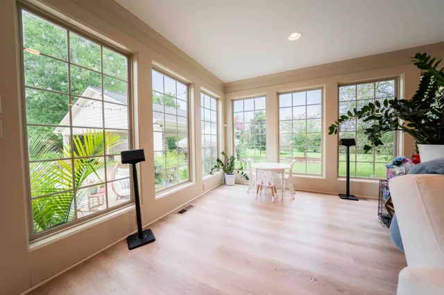 a large kitchen with stainless steel appliances granite countertop a lot of counter space and wooden floors