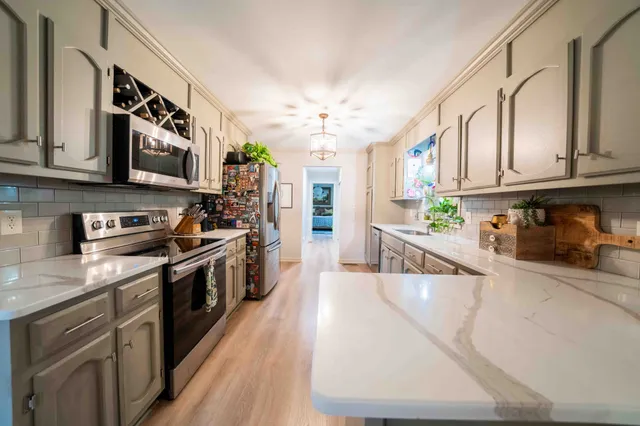 a bedroom with a bed and a window with outer view