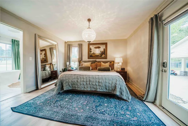 a bathroom with a shower and a glass door