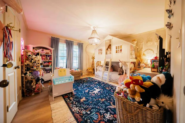 a living room with lots of furniture and a mirror