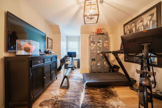 an aerial view of residential houses with outdoor space and swimming pool