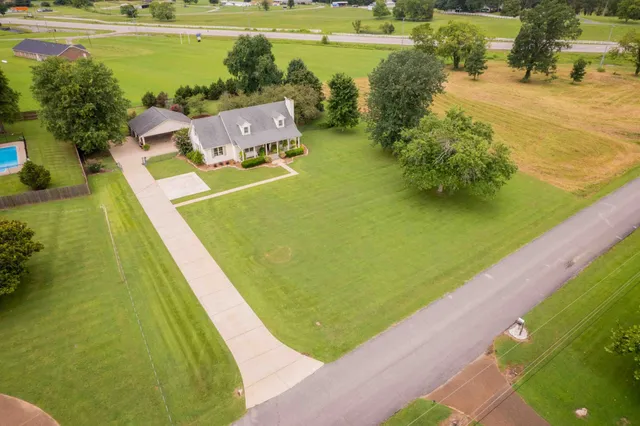 a view of a lake with a yard