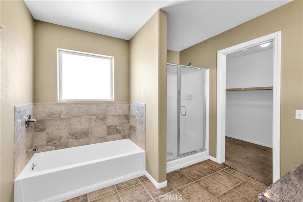 63357 Uranium Road Joshua Tree, CA 92252 - Photo 18 of 54 a bathroom with a bathtub and a shower