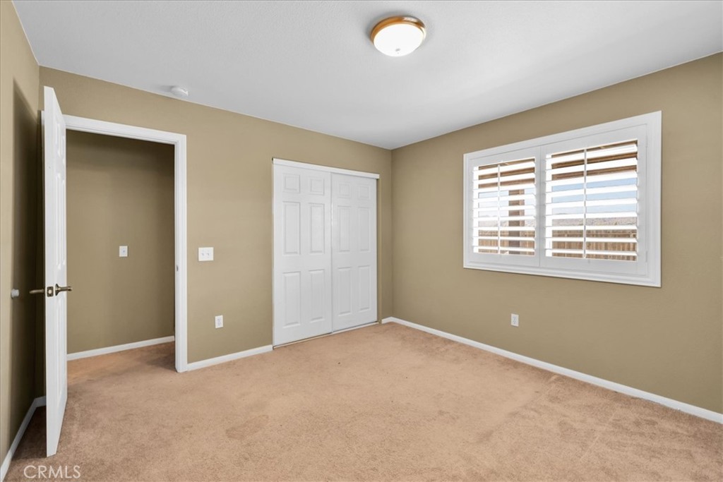 63357 Uranium Road Joshua Tree, CA 92252 - Photo 21 of 54 an empty room with windows