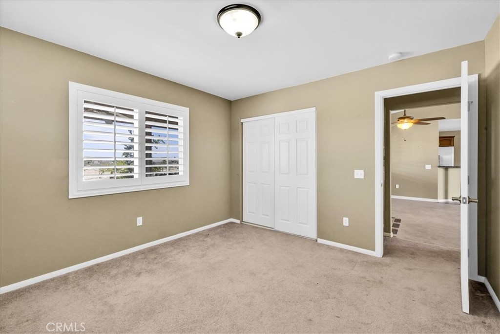 63357 Uranium Road Joshua Tree, CA 92252 - Photo 22 of 54 an empty room with windows and closet