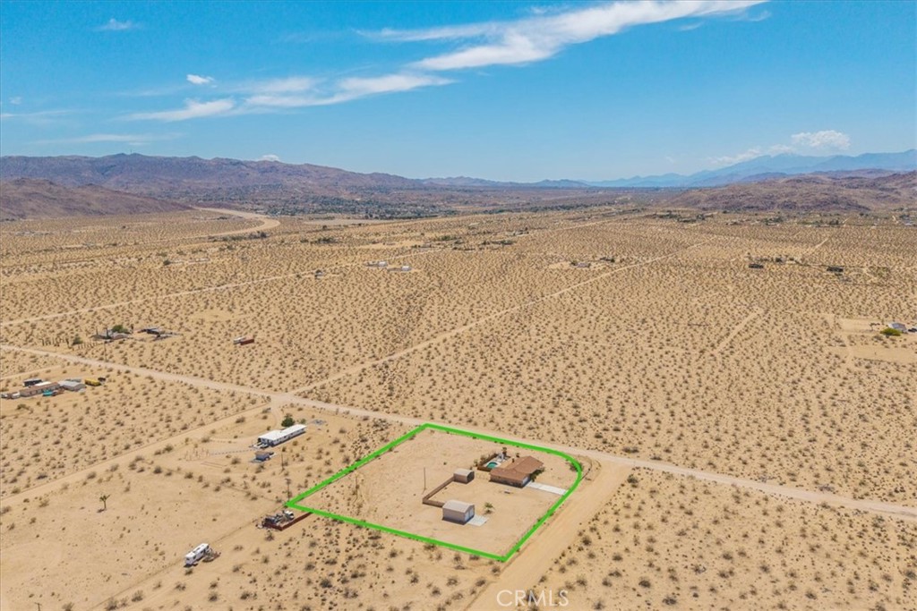63357 Uranium Road Joshua Tree, CA 92252 - Photo 50 of 54 a view of an ocean beach and mountain