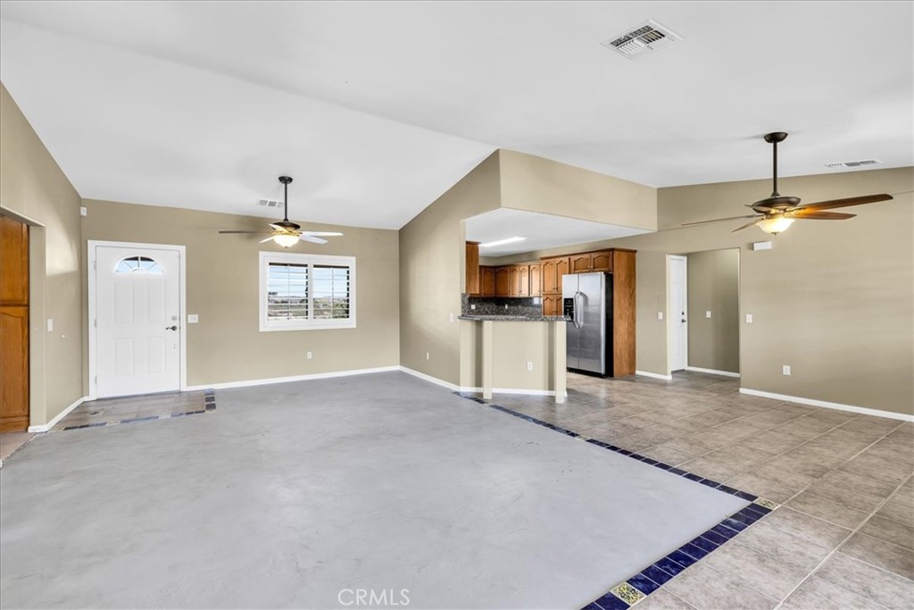 63357 Uranium Road Joshua Tree, CA 92252 - Photo 5 of 54 a view of a kitchen with a sink and a refrigerator