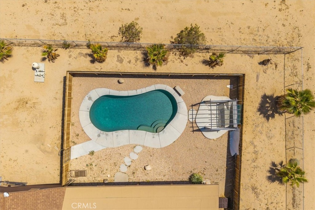 63357 Uranium Road Joshua Tree, CA 92252 - Photo 53 of 54 an aerial view of a house with a swimming pool
