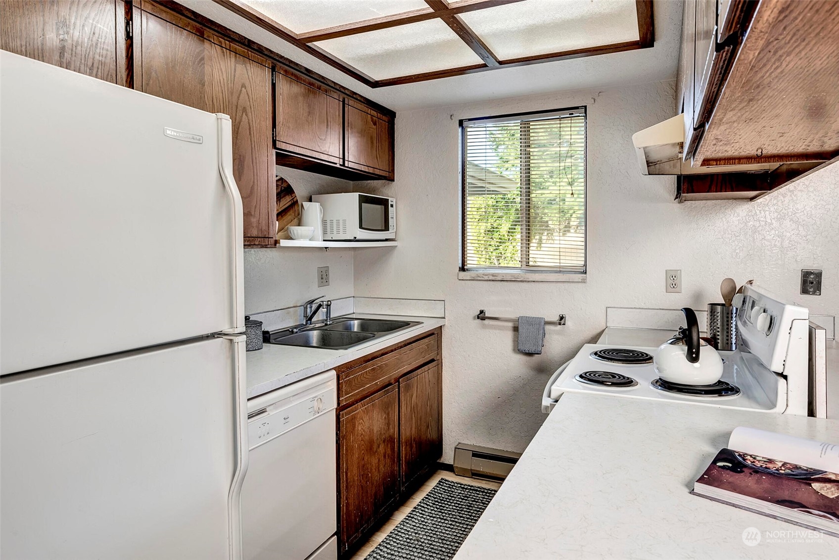 2924 Northeast 8th Street Renton, WA 98056 - Photo 5 of 33 a kitchen with sink a stove and a refrigerator