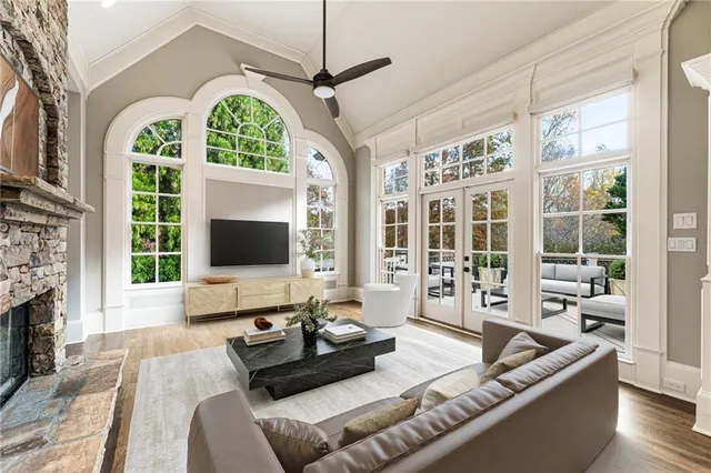 a kitchen with kitchen island granite countertop a sink a center island and stainless steel appliances