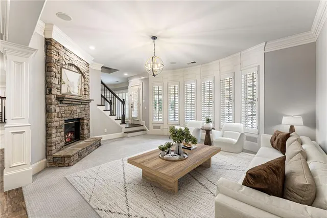 a kitchen with stainless steel appliances granite countertop a sink a stove and a refrigerator