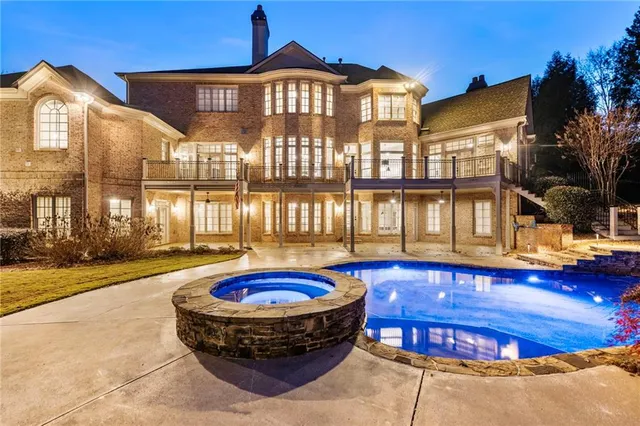 a front view of a house with a big yard